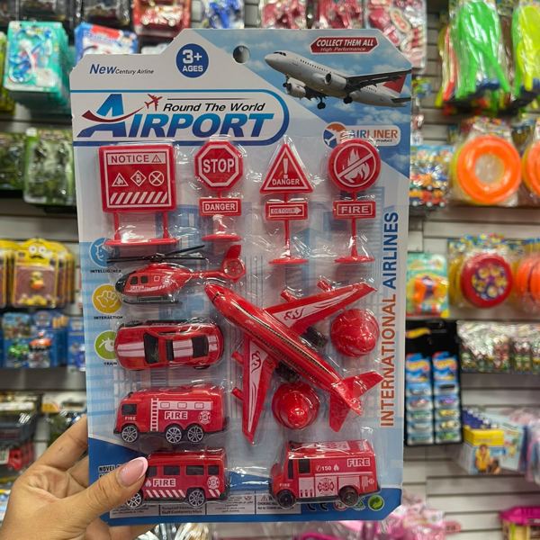 Set aeropuerto con avión y vehículos rojo